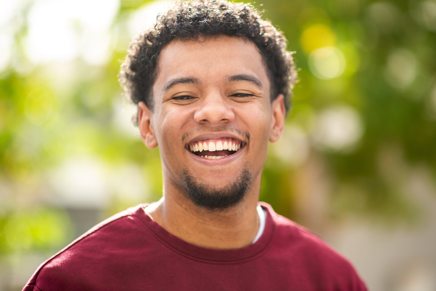 Smiling adult man outdoors