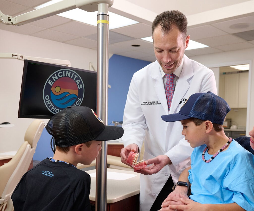 Dr. Liatti evaluating a young patient at Encinitas Orthodontics
